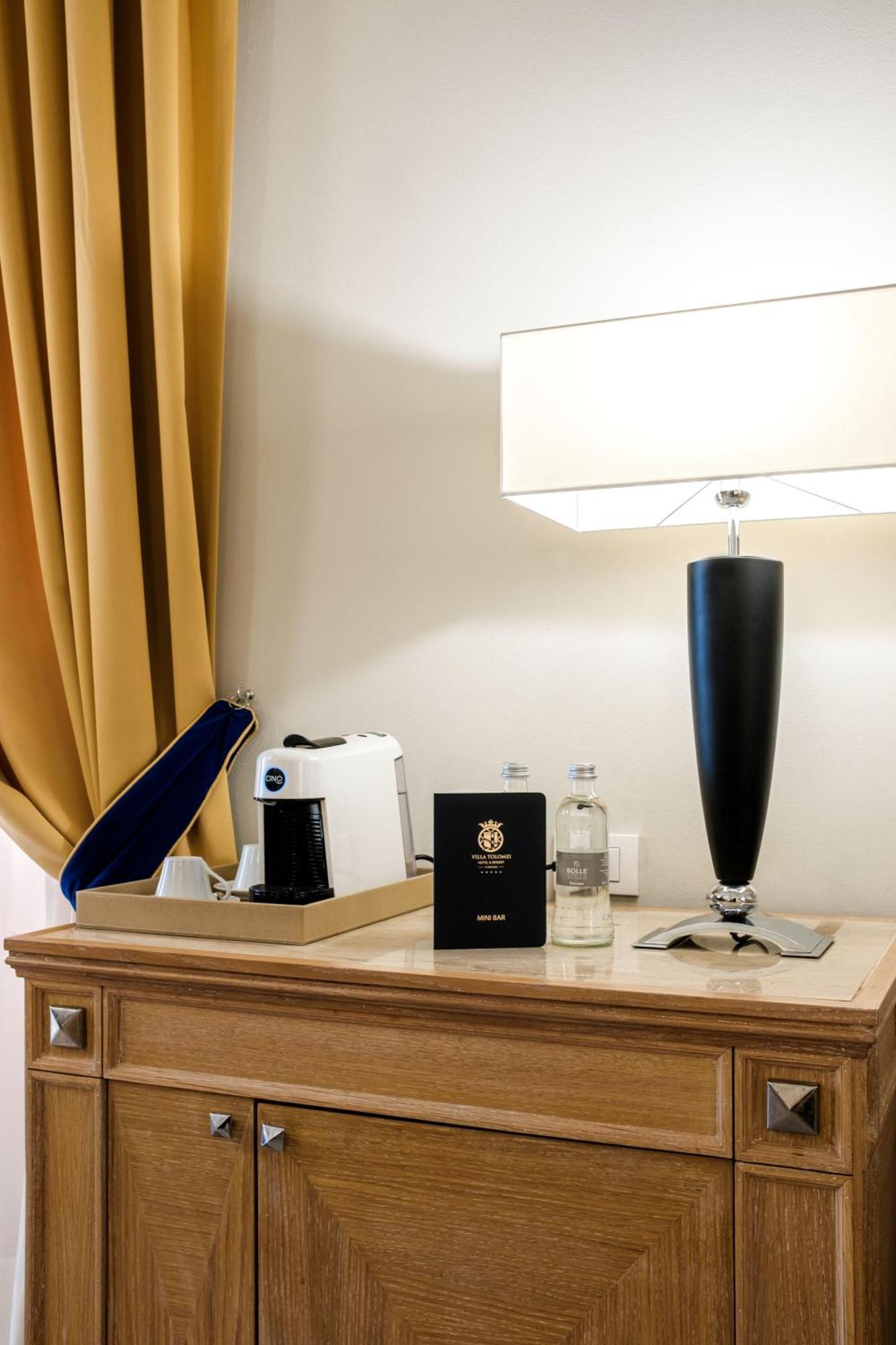 Villa Tolomei Hotel&Resort Firenze Esterno foto A Nespresso machine in a hotel room